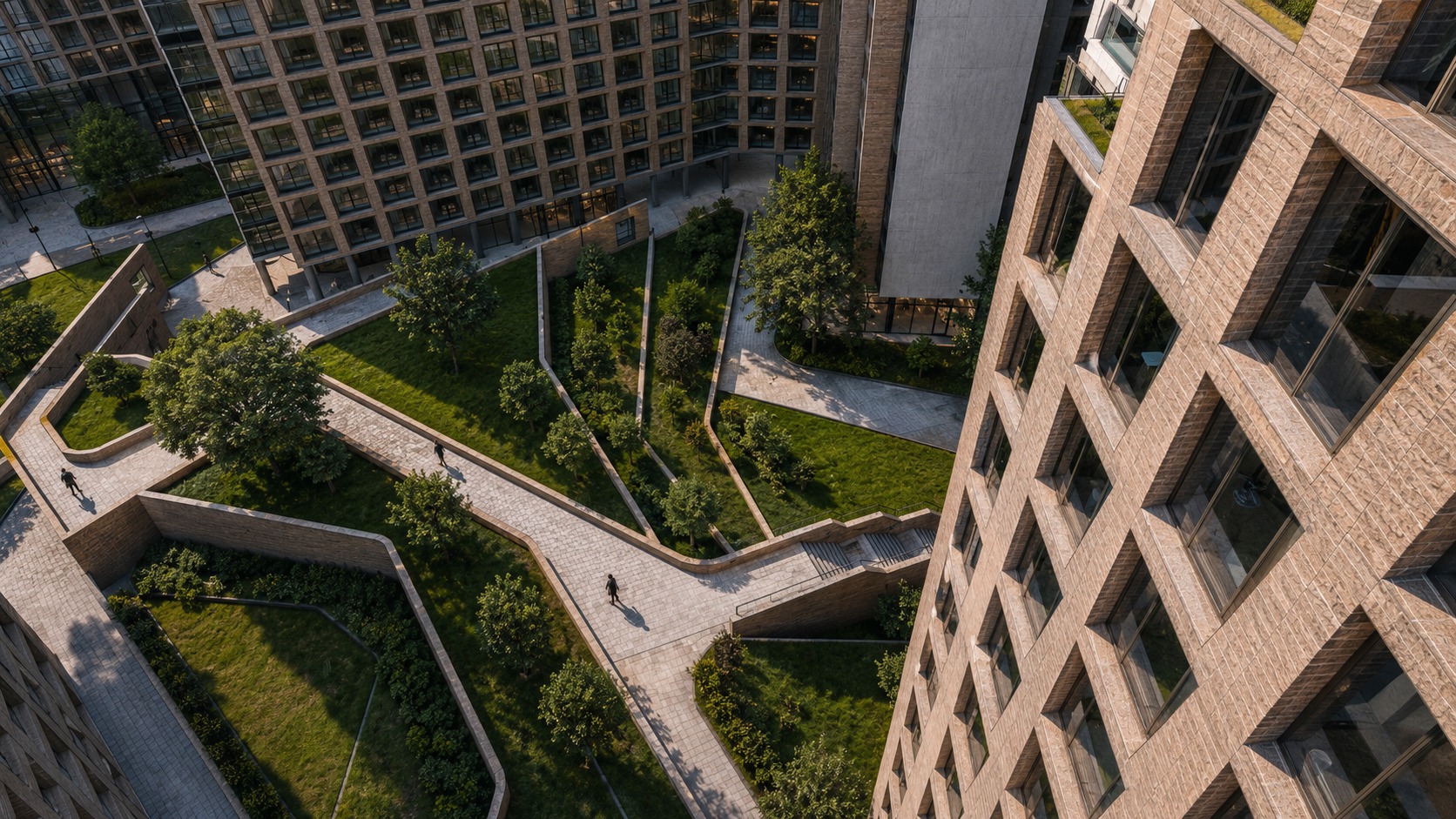 Aerial — landscaped courtyard paths between the perimeter blocks