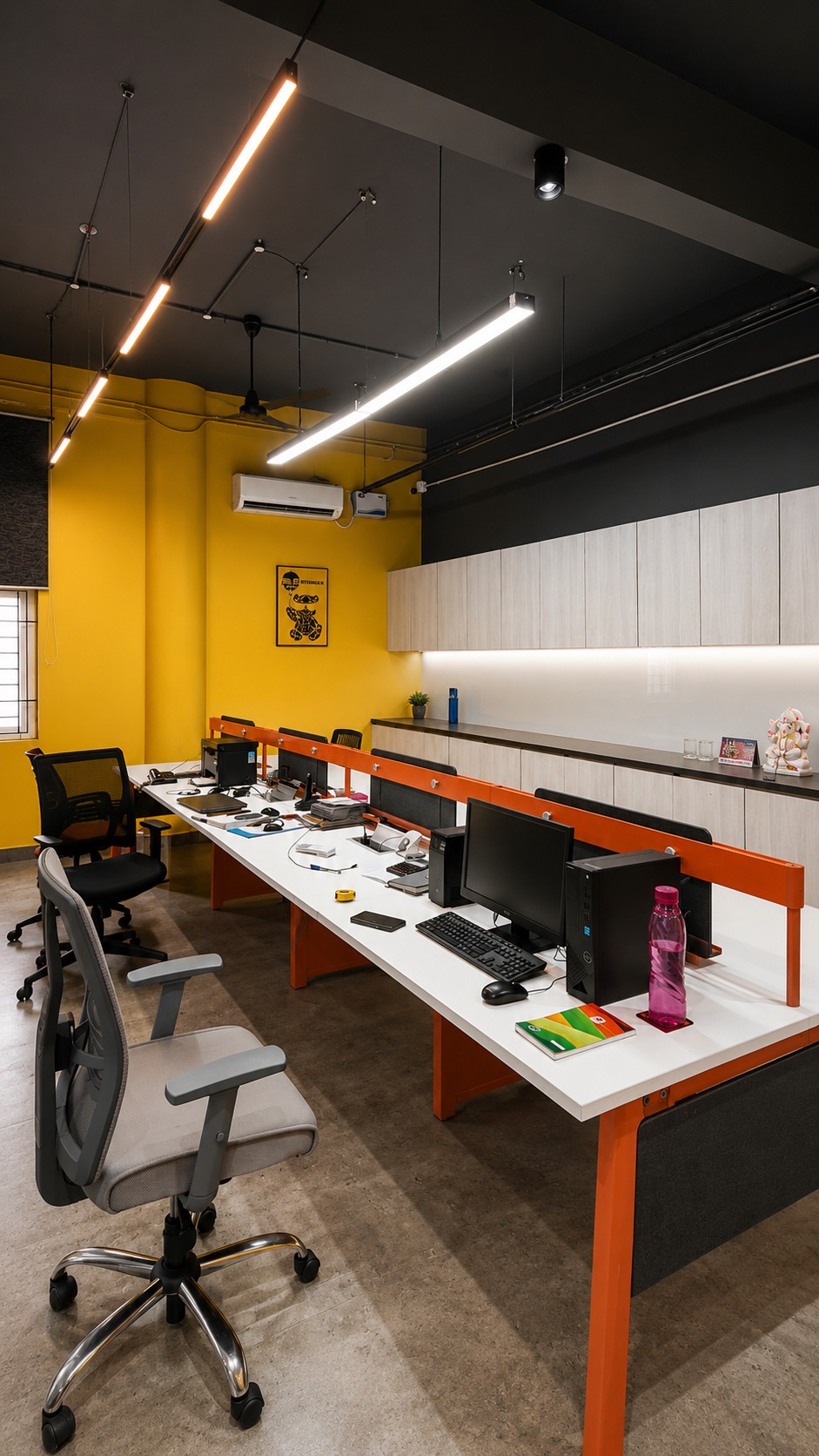 Office fit-out — workstations under linear pendant lighting