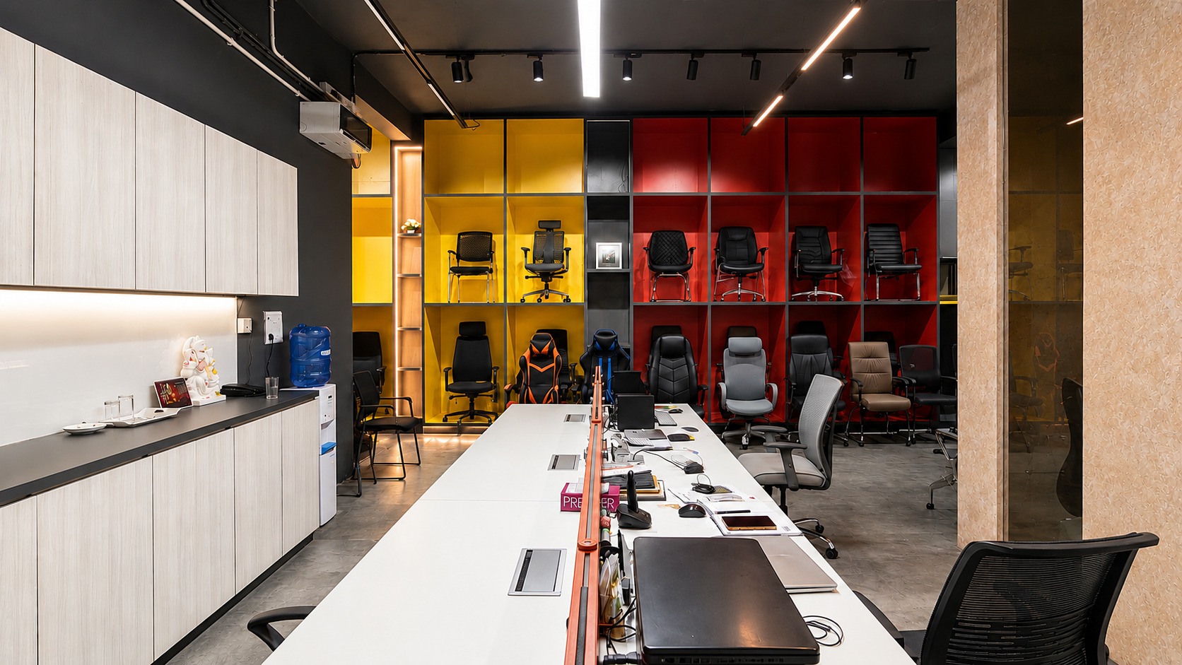 Showroom — chair display wall in colour-blocked bays