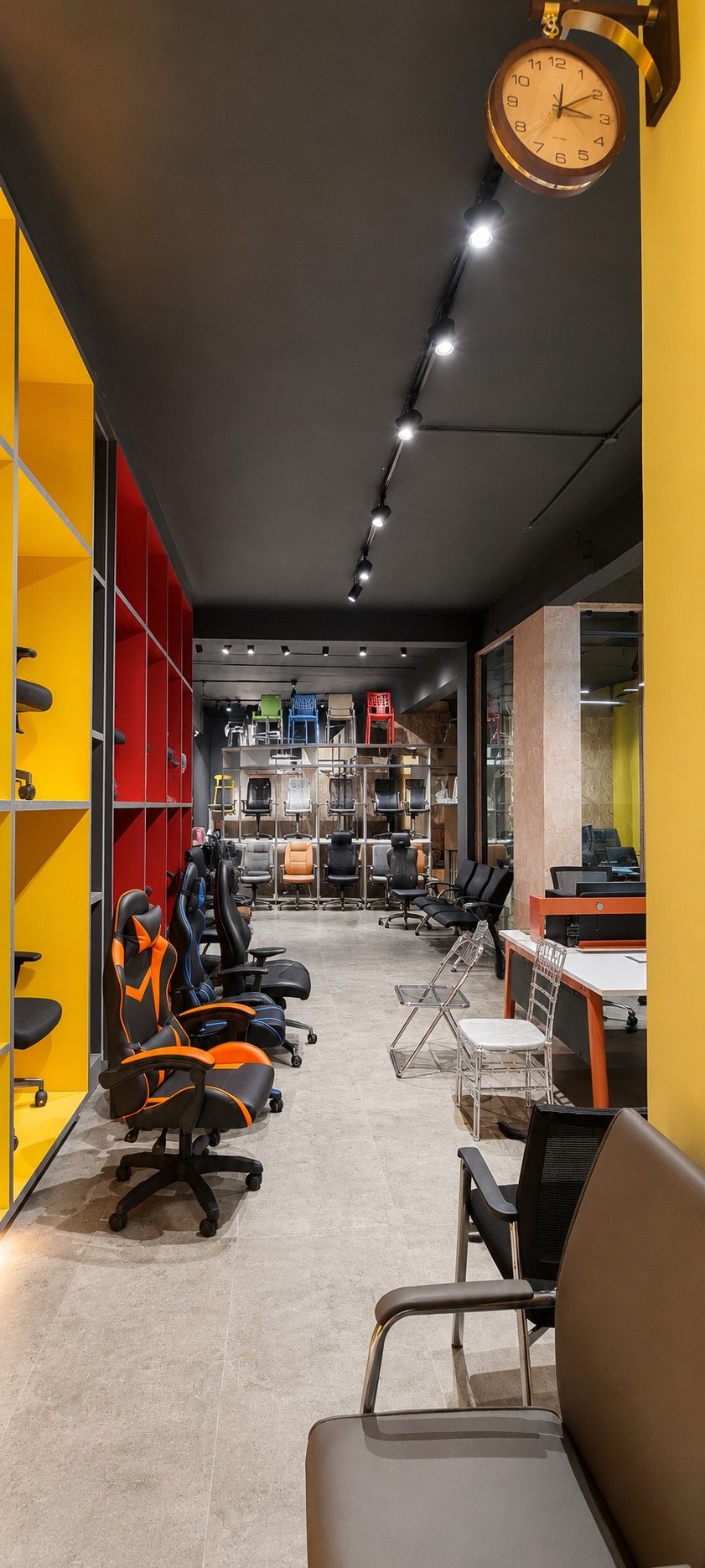 Showroom — chair aisle beneath a decorative wall clock