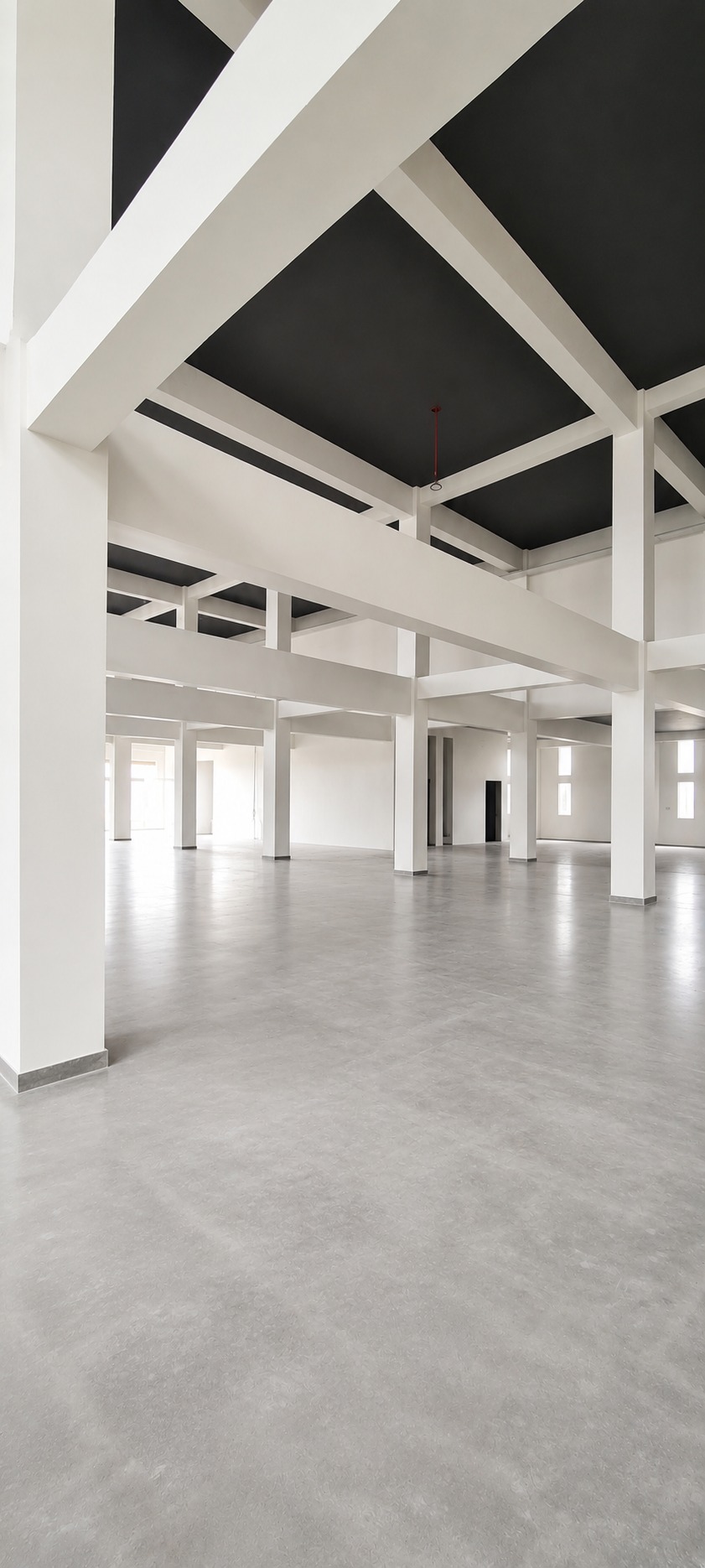Manufacturing floor — the exposed structural grid before fit-out
